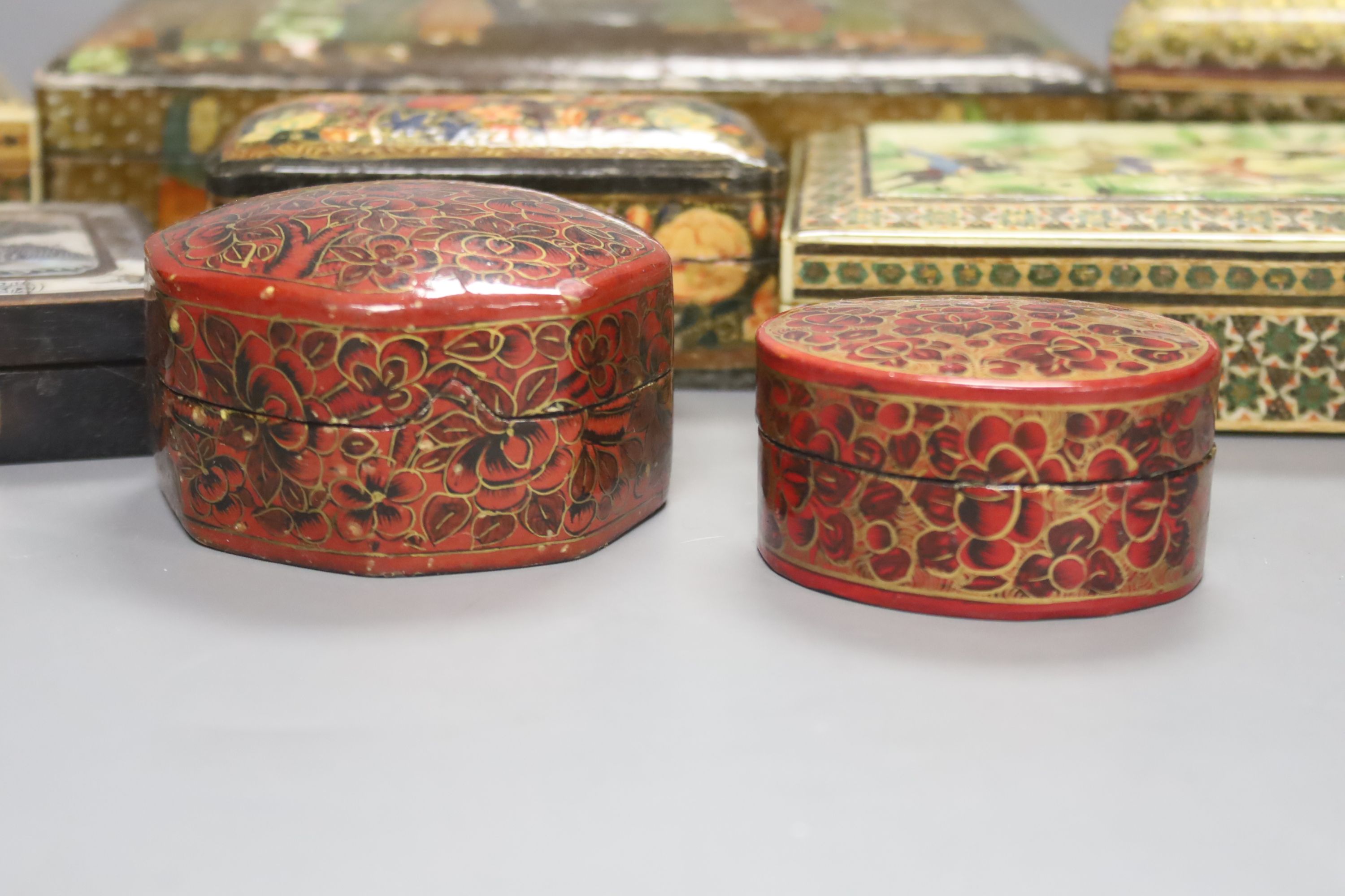 Four Persian painted lacquer boxes and four others